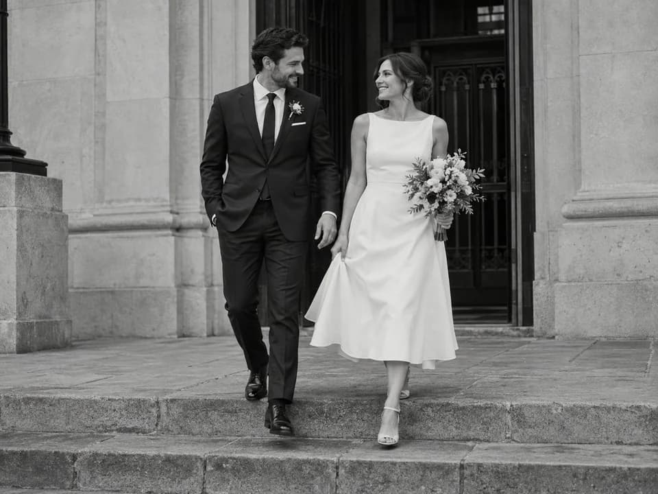 Fictional couple shown as a black-and-white city hall wedding style reference
